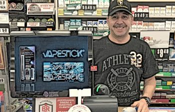 store owner with system National Retail Systems pic adj